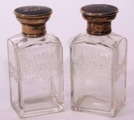 Two George V silver and tortoiseshell mounted clear glass toiletry bottles each of rectangular