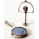 Mixed Lot: comprising a polished novelty hand mirror (lacking glass) with ring suspension together