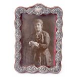 Edward VII silver mounted easel backed photograph frame, the pinned and embossed rope twist mount