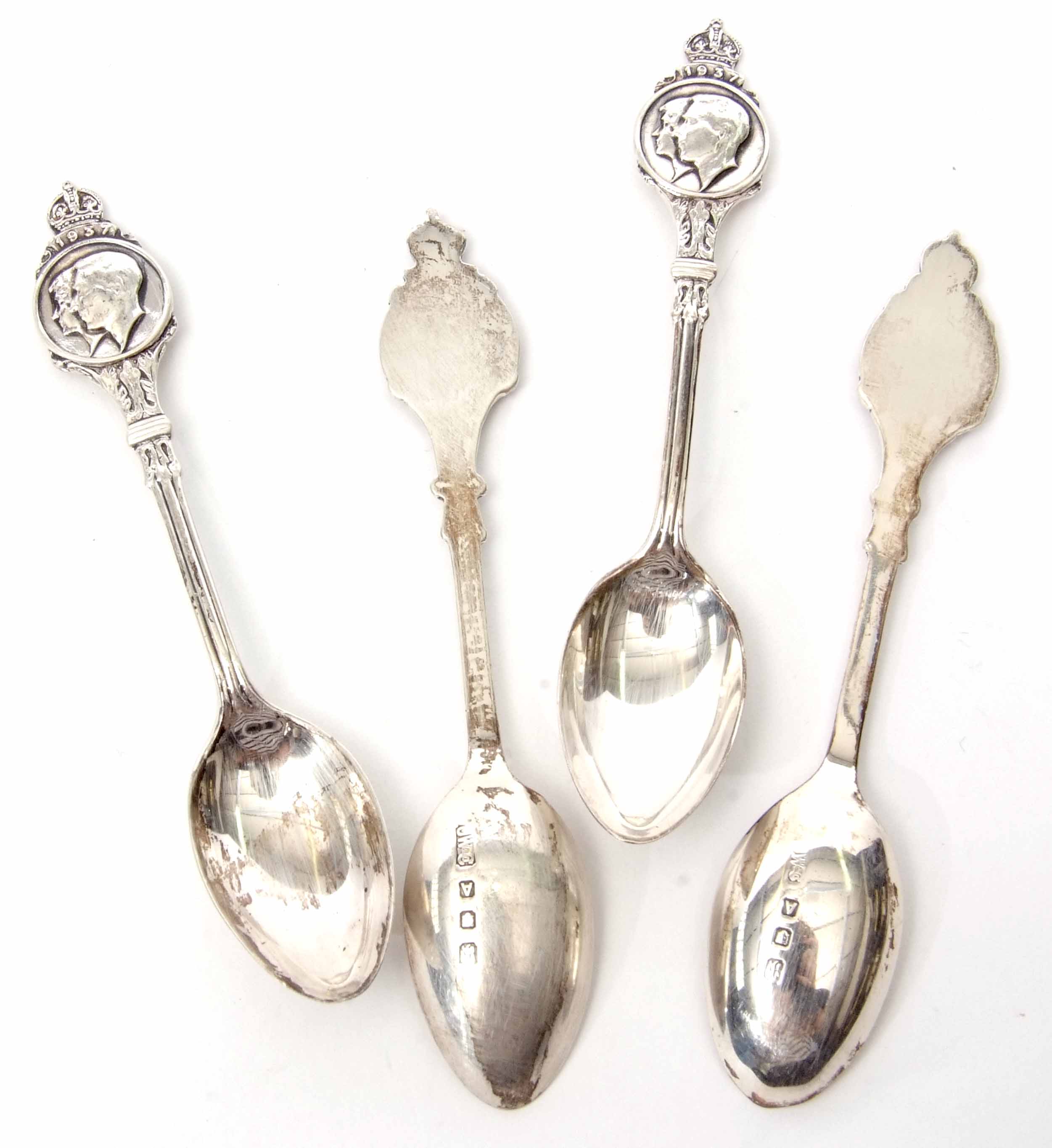 Four George VI Coronation commemorative coffee spoons, each with twin portrait crowned finials dated