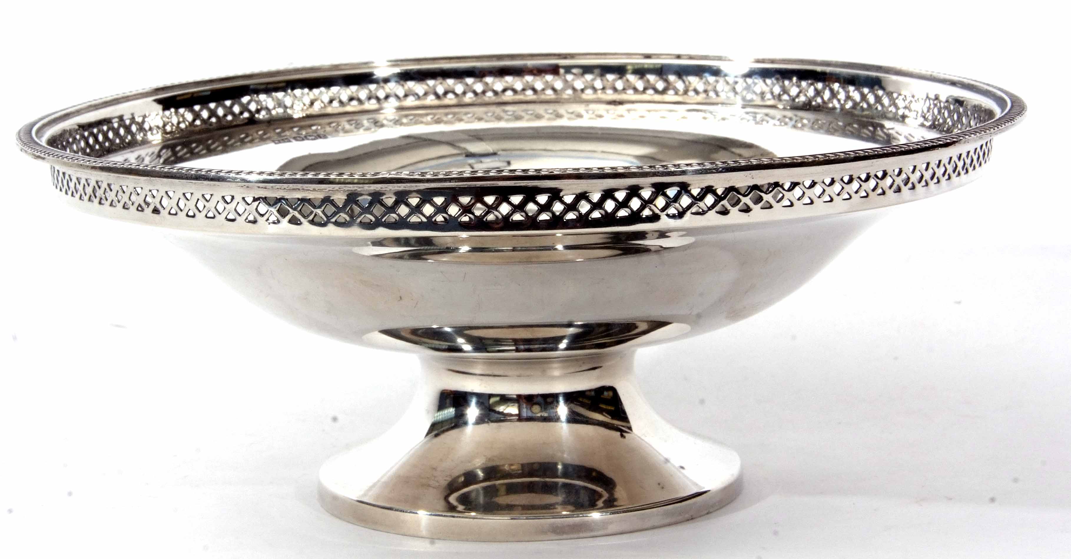 George V footed bowl of plain polished circular form with cast and applied rim and narrow pierced