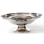 George V footed bowl of plain polished circular form with cast and applied rim and narrow pierced