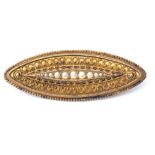 Antique Etruscan lozenge shaped brooch featuring a central row of graduated seed pearls raised in