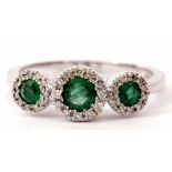 Triple emerald and diamond cluster ring featuring three graduated emeralds, 0.66ct weight approx,