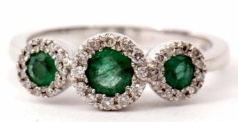 Triple emerald and diamond cluster ring featuring three graduated emeralds, 0.66ct weight approx,