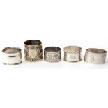 Mixed Lot: comprising three various silver napkin rings including cylindrical and oval forms,