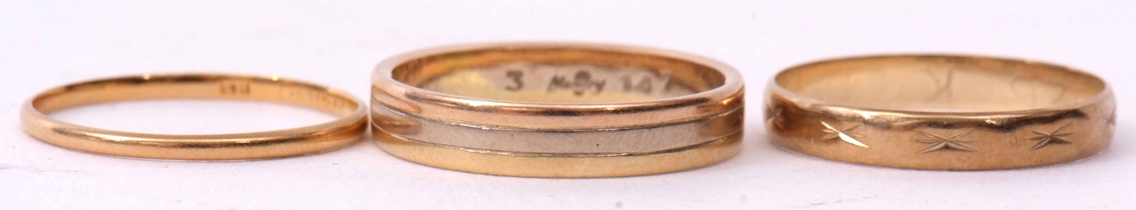 Mixed Lot: 18ct two tone gold wedding ring, 2.7gms, size K, a 9ct gold wedding ring, 0.8gms,