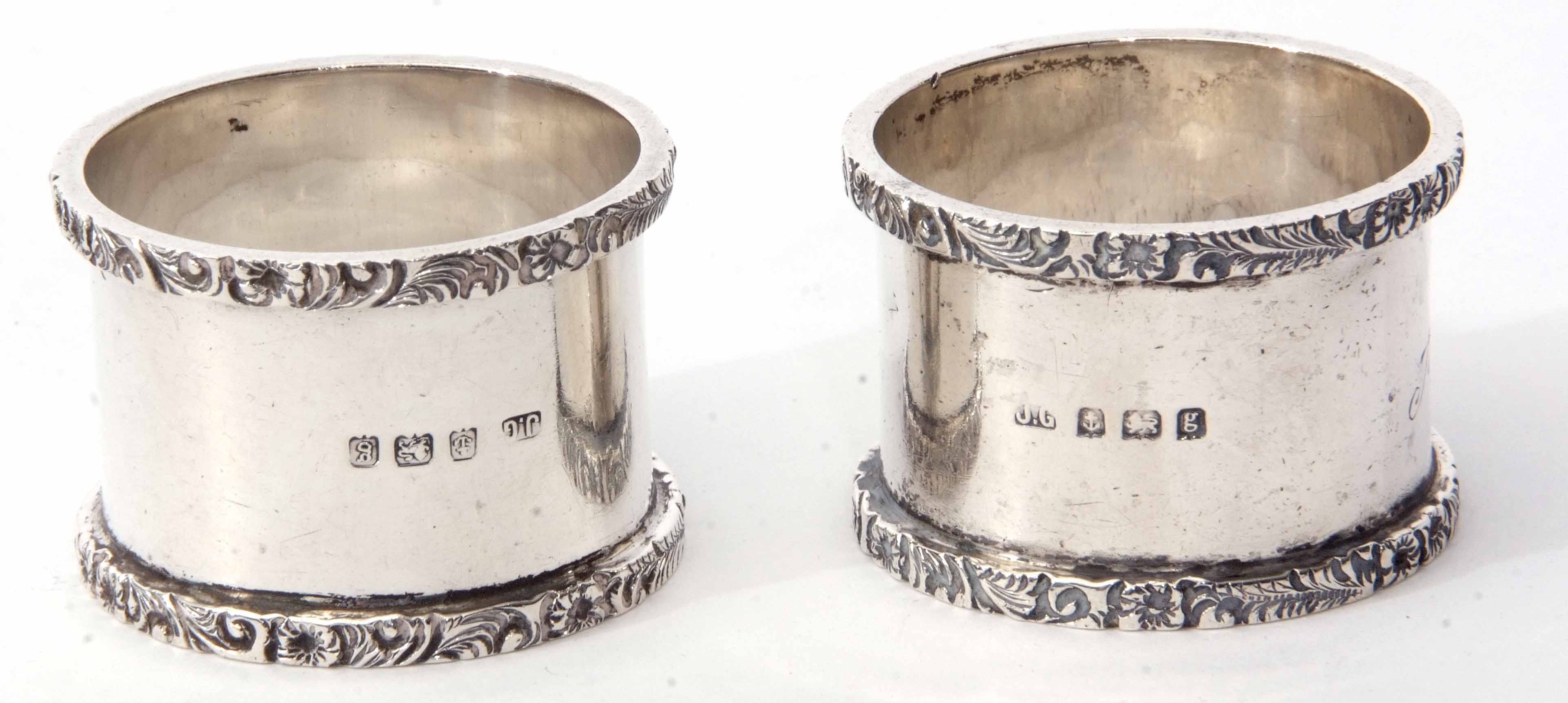 Two Edward VII cylindrical napkin rings, each of polished form with cast and applied rims and - Image 2 of 2