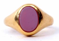 An 18ct gold and sardonyx signet ring, the oval plaque set in a rub-over setting, hallmarked