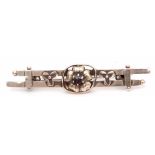 A 9ct gold double bar brooch, a small garnet in a flowerhead setting (a/f)