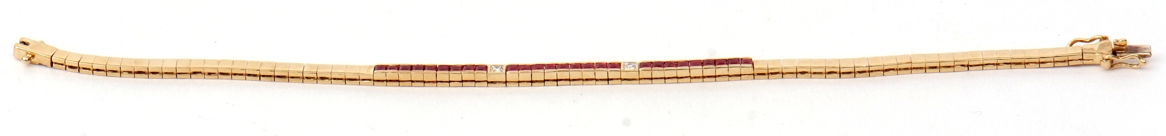 A 14K stamped ruby and diamond line bracelet, featuring 24 channel set calibre cut rubies and two - Image 2 of 2