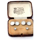 Cased set of octagonal cuff links with mother of pearl panels and chain connectors, together with