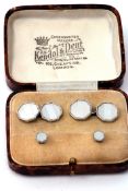 Cased set of octagonal cuff links with mother of pearl panels and chain connectors, together with