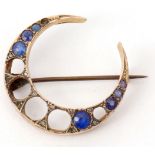 Edwardian crescent brooch featuring seven (of 13) graduated circular cut sapphires, 30 x 23mm,