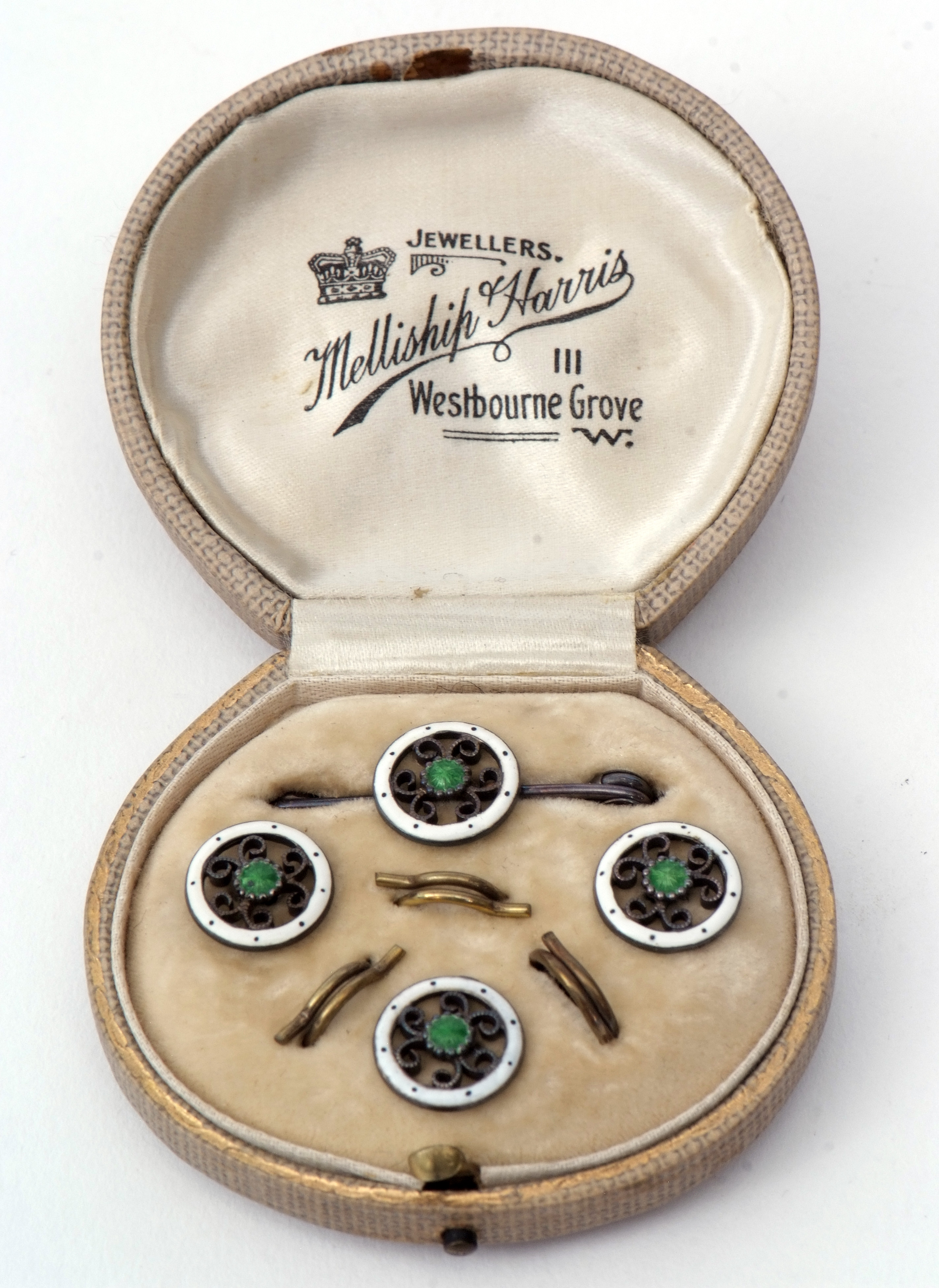 Early 20th century cased set of three unmarked white metal and enamelled waistcoat buttons with