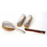 Part silver backed dressing table set comprising hand brush, pair of clothes brushes and silver