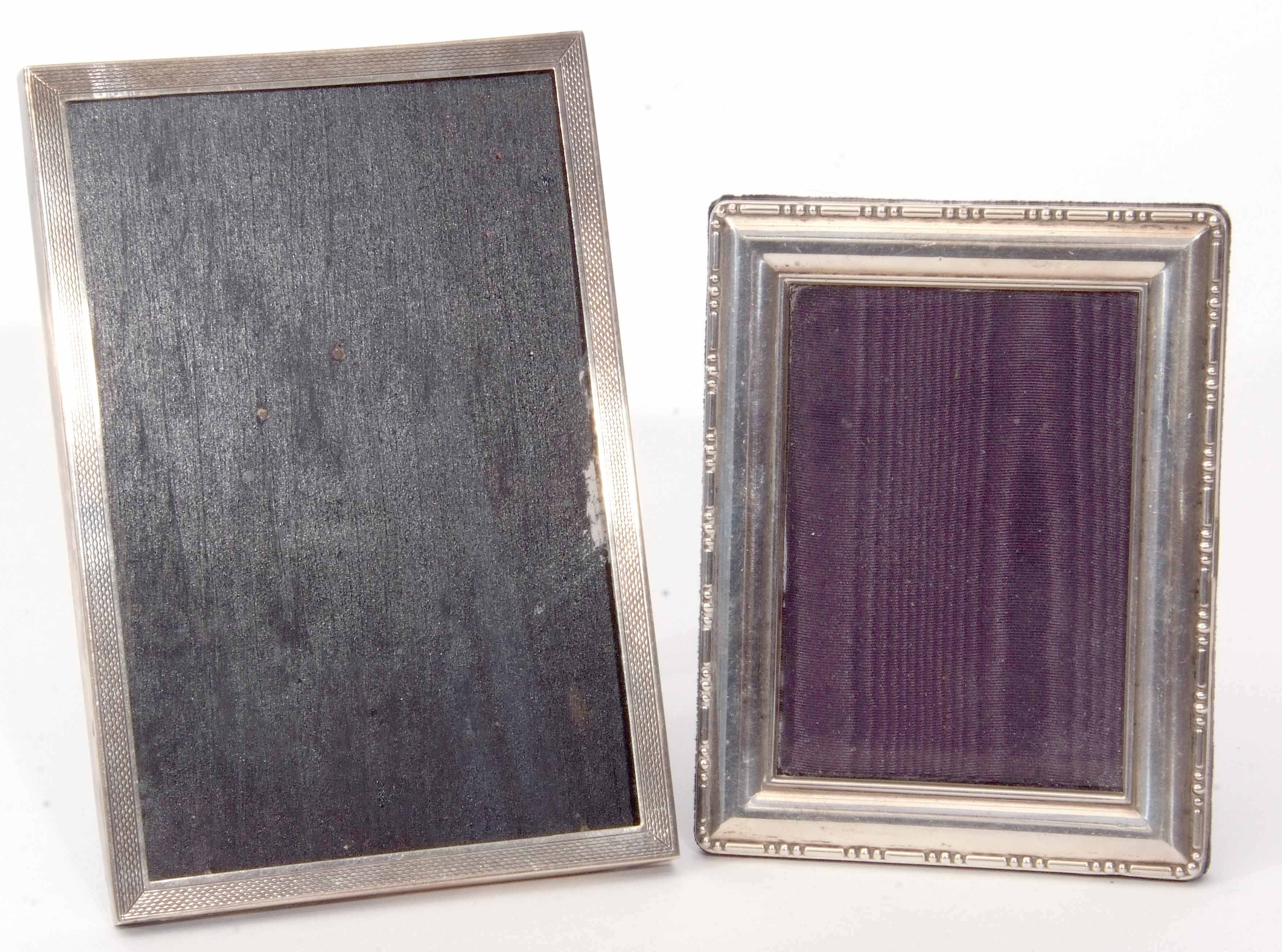 Mixed Lot: comprising two various silver mounted easel backed photograph frames, the first of engine