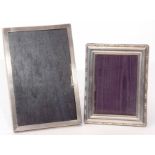 Mixed Lot: comprising two various silver mounted easel backed photograph frames, the first of engine