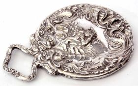 Edward VII dressing table hand mirror of embossed form with integral handle and decorated throughout