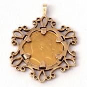 Edward VII gold sovereign dated 1908, mounted in a 9ct gold scroll framed pendant, gross weight 8.