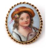 Hand painted porcelain brooch, a portrait of a young lady wearing a bonnet, 3.5 x 2.5cm, framed in a