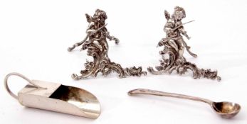 Mixed Lot: comprising two easel backed menu holders, each cast in the form of a putti playing a