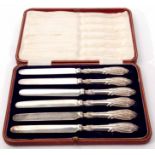 Cased set of six silver handled tea knives in a fabric lined and red fitted morocco covered case