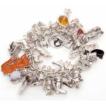 White curb link bracelet suspending various charms, mainly cats, 132gms gross weight