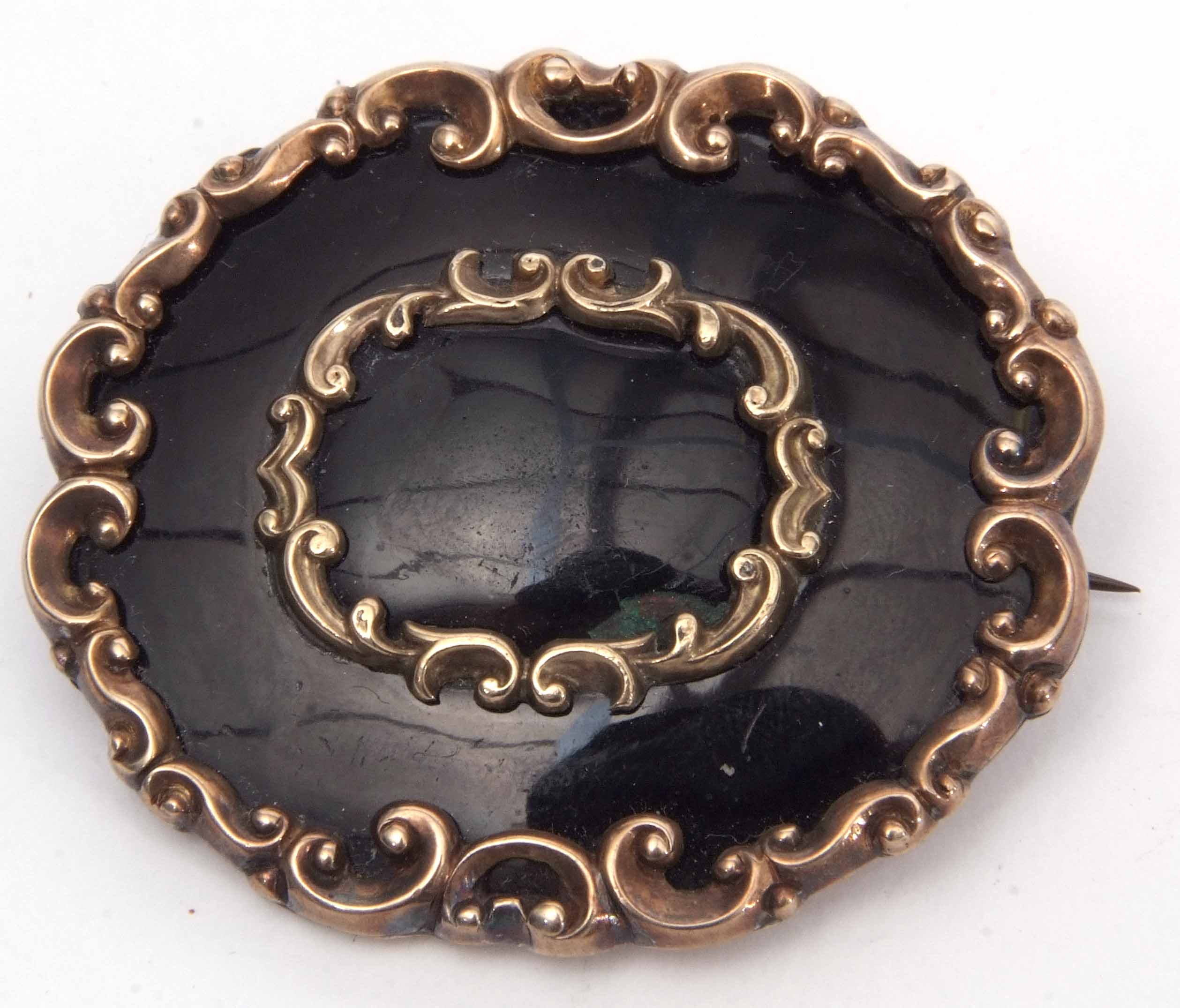Large Victorian gold filled and black enamel mourning brooch, 5 x 4cm with a vacant panel verso