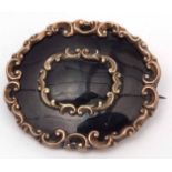 Large Victorian gold filled and black enamel mourning brooch, 5 x 4cm with a vacant panel verso