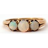 Three stone opal ring, featuring three graduated cabochon cut opals, individually claw set and