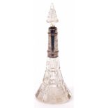 George V silver mounted and clear glass toiletry bottle of trumpet form with prismatic stopper and