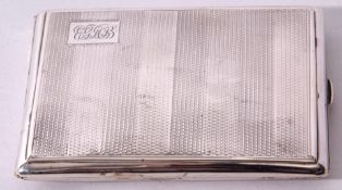 George V cigarette case of hinged rectangular form with all over engine turned decoration and