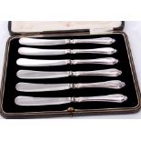 Cased set of six silver handled tea knives in a fabric lined fitted case