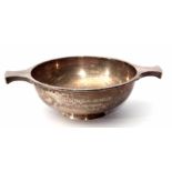 George V two-handled quaich of plain polished circular form with waisted side handles and