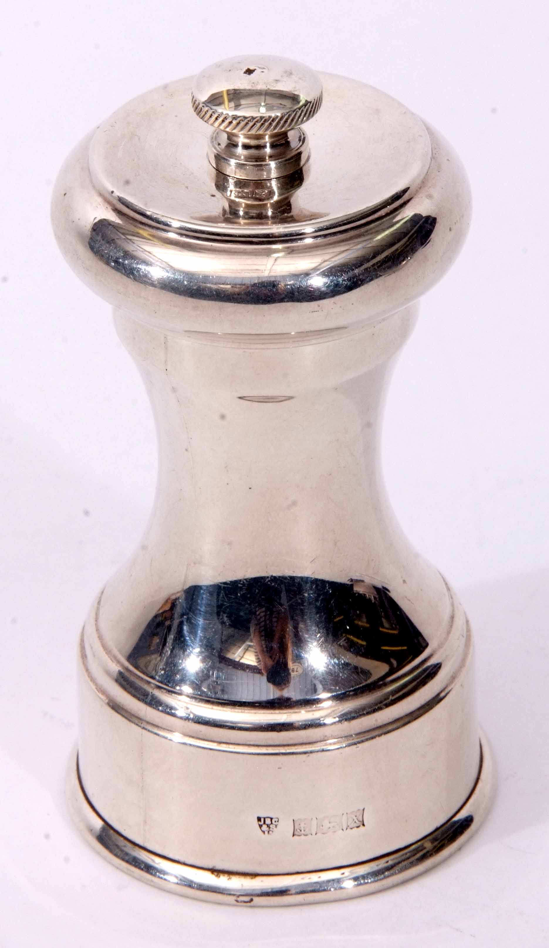 Elizabeth II silver mounted pepper grinder of waisted cylindrical form with rotating top and