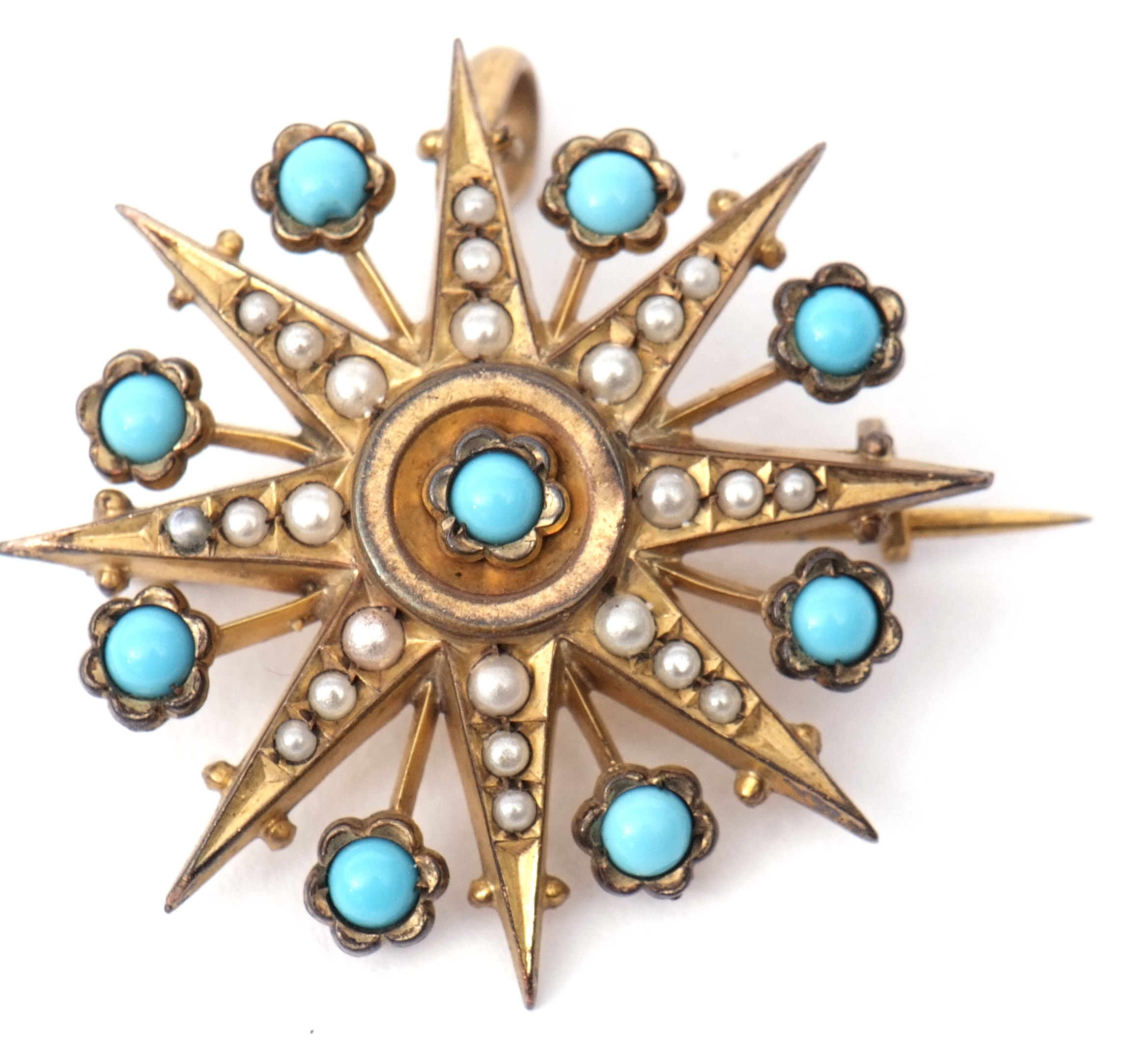 Vintage gilt metal starburst brooch, featuring nine turquoise small stones and graduated small