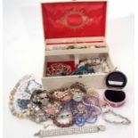 Cream leatherette folding jewel box to include mainly necklaces, crystal and faux pearl examples,