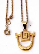 Stylised modern pendant, stamped 585, 3.6gms, on a gilt metal chain