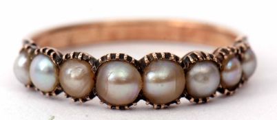 Antique seed pearl ring featuring eight graduated seed pearls in a curved enclosed setting between