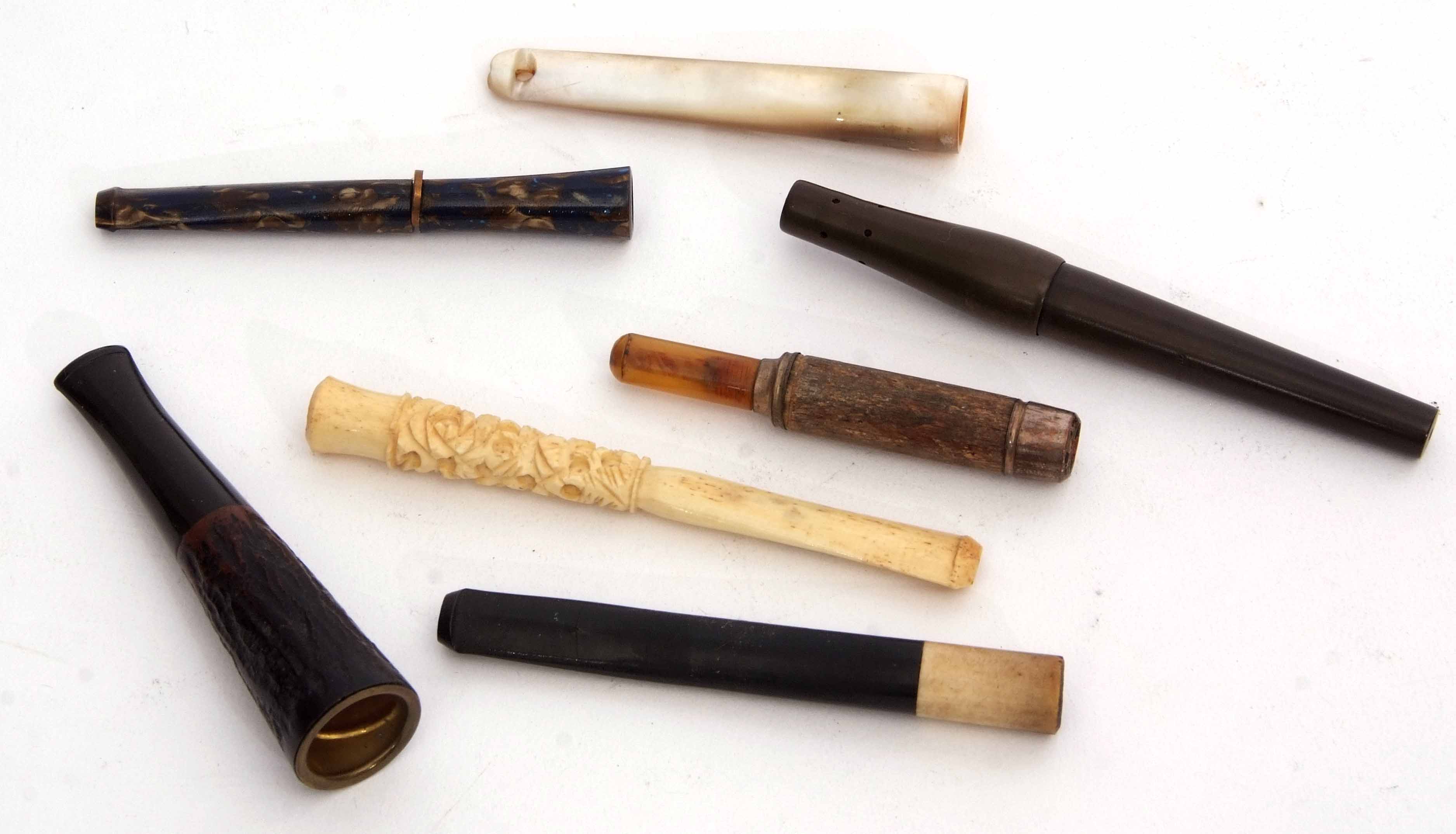 Mixed Lot: comprising an early 20th century cased Dunhill cigarette holder of sliding form with