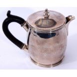 George V hot water pot of polished barrel form with pull off cover with cast and applied knop finial