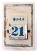 20th century white onyx and inlaid desk calendar of rectangular form with strut back and white metal