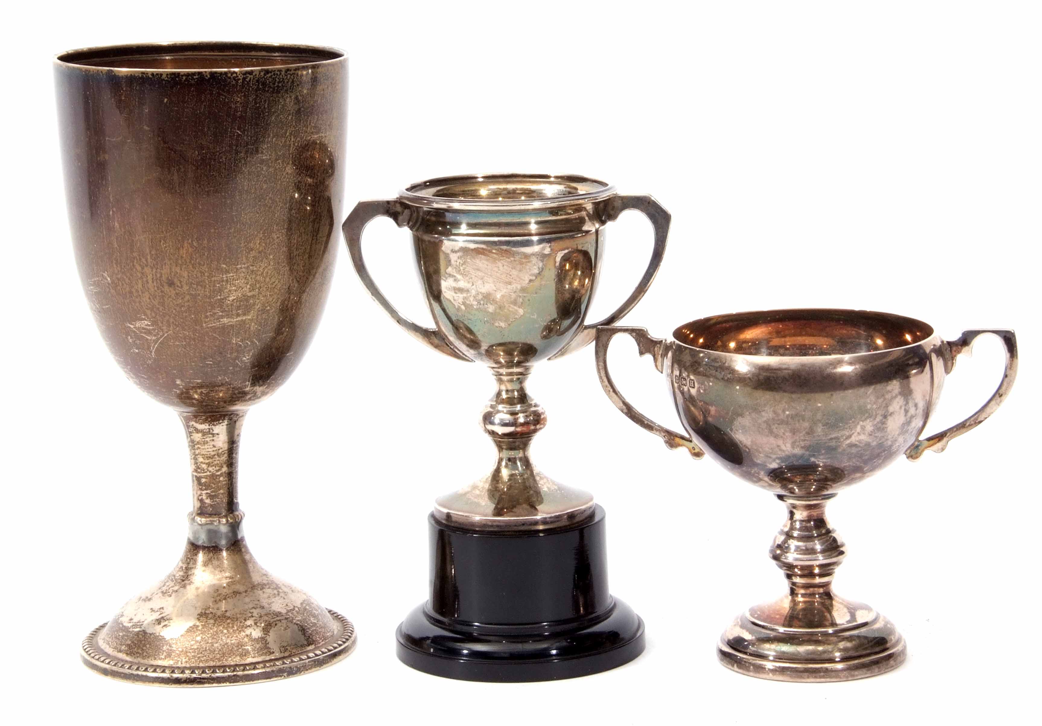 Mixed Lot: comprising three various unengraved trophy cups, combined weight approx 213gms all in,