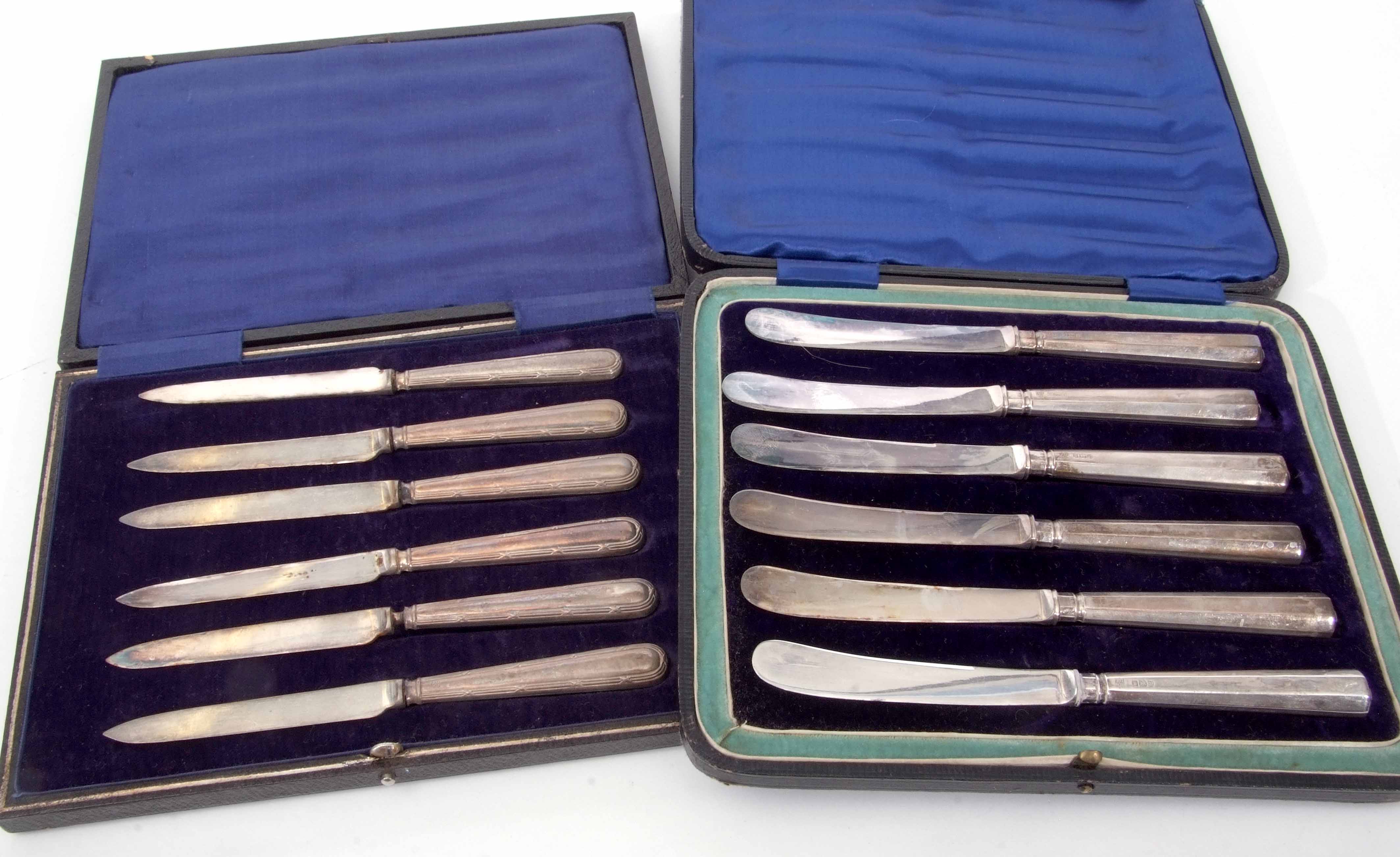 Mixed Lot: comprising two various cased sets of silver handled tea knives, various dates and