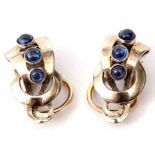 Pair of designer style earrings set with three graduated bezel set cabochon sapphires, each