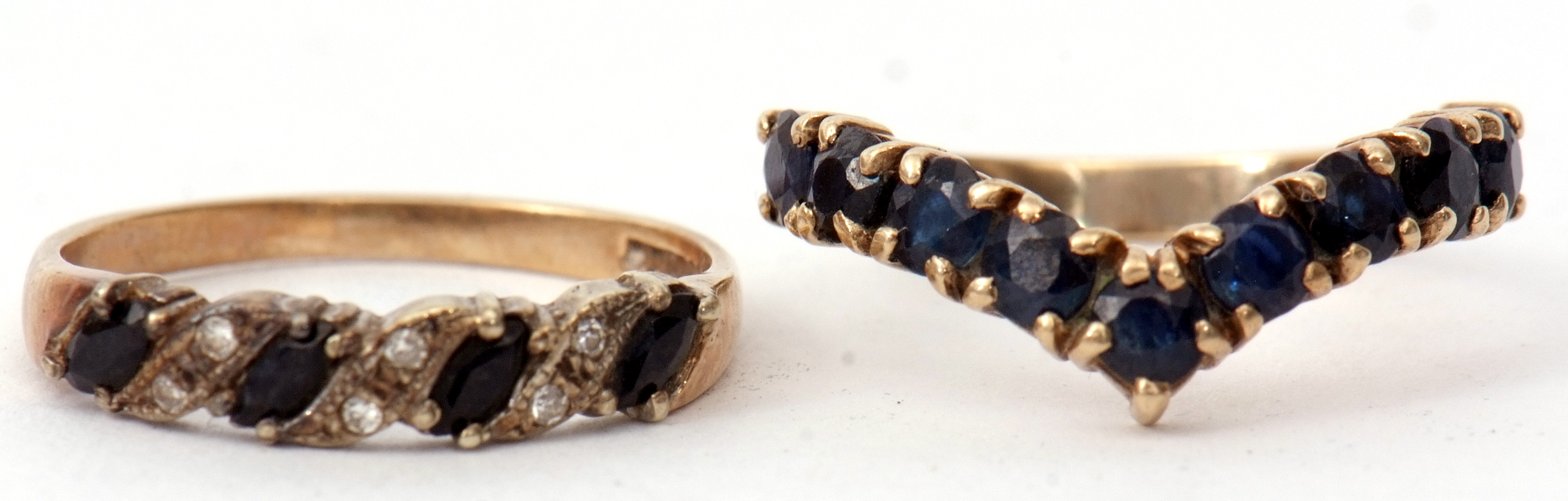 Mixed Lot: 9ct gold, sapphire and diamond ring featuring four faceted lozenge shaped dark sapphires,