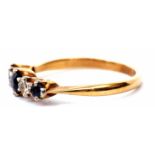 A five stone sapphire and diamond ring, line set with three graduated small sapphires and two