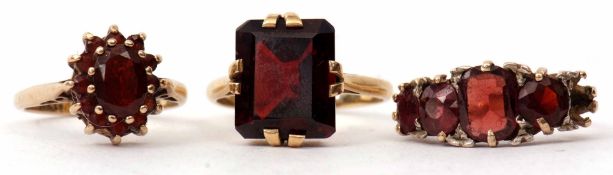 Mixed Lot: 18ct stamped rectangular shaped garnet dress ring, 9ct gold garnet cluster ring, together