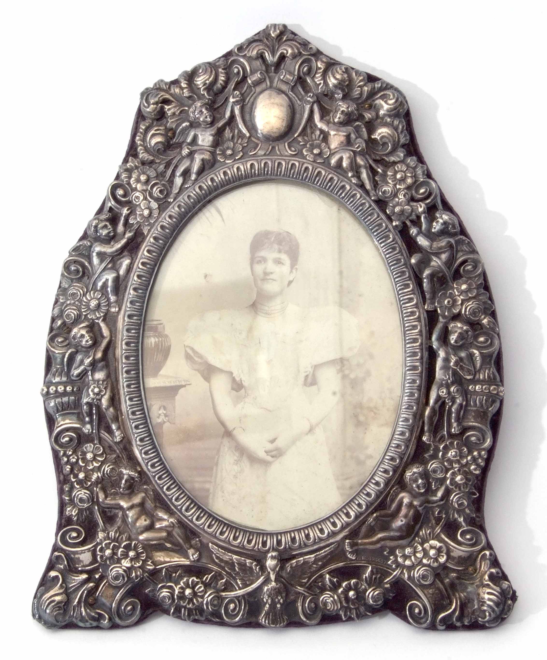 Late Victorian silver mounted photograph frame, the screw attached mount of pierced form profusely